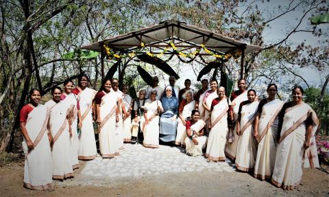 Sisters gather around a statue of Anna Dengel on the day of blessing