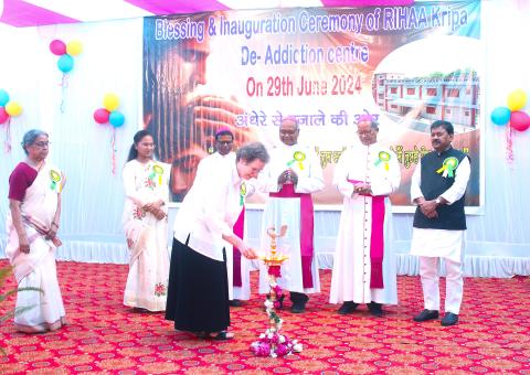 Sister Agnes, Society Coordinator, lights the lamp 