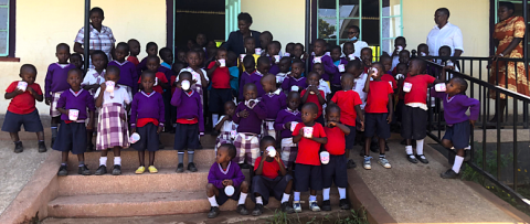 Children enjoying a cup of tea during their break, Anna Dengel Education Centre, Ang'iya, Kenya  